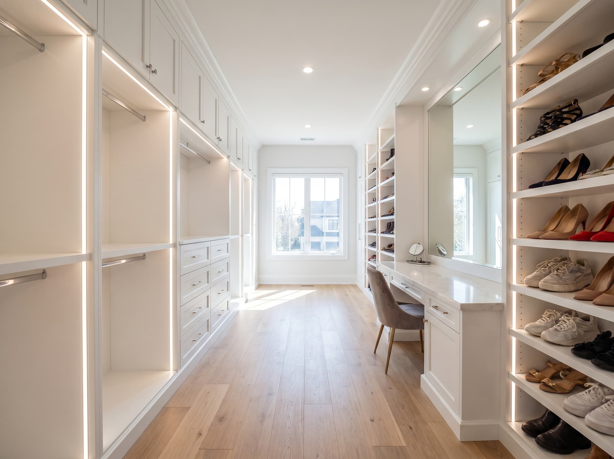 Norcross, GA · His-and-hers walk-in with a vanity counter and open shoe wall.