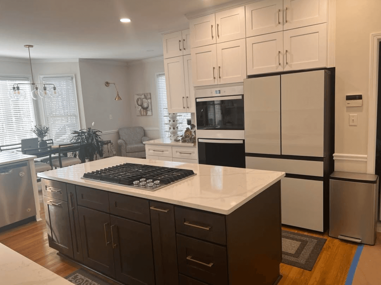 Marietta, GA · Two-tone kitchen — white perimeter with stained island and quartz tops.