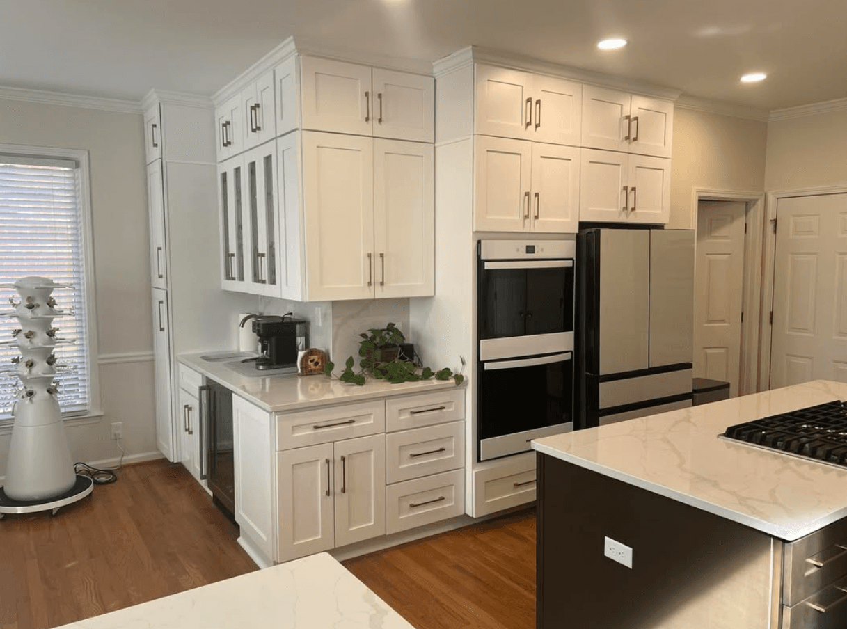 Roswell, GA · White shaker with glass-front display uppers and double wall ovens.