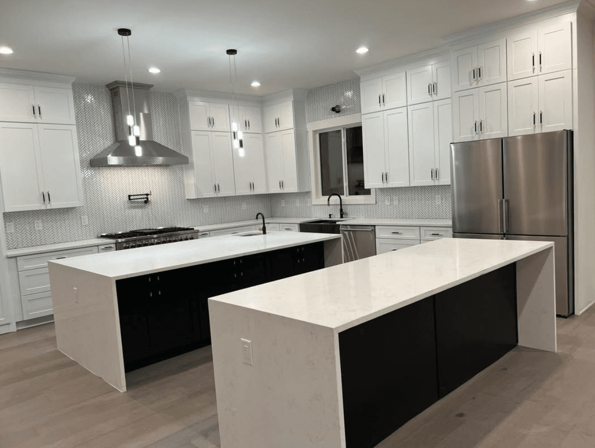 Sandy Springs, GA · Modern white kitchen with stainless French-door fridge and gas range.
