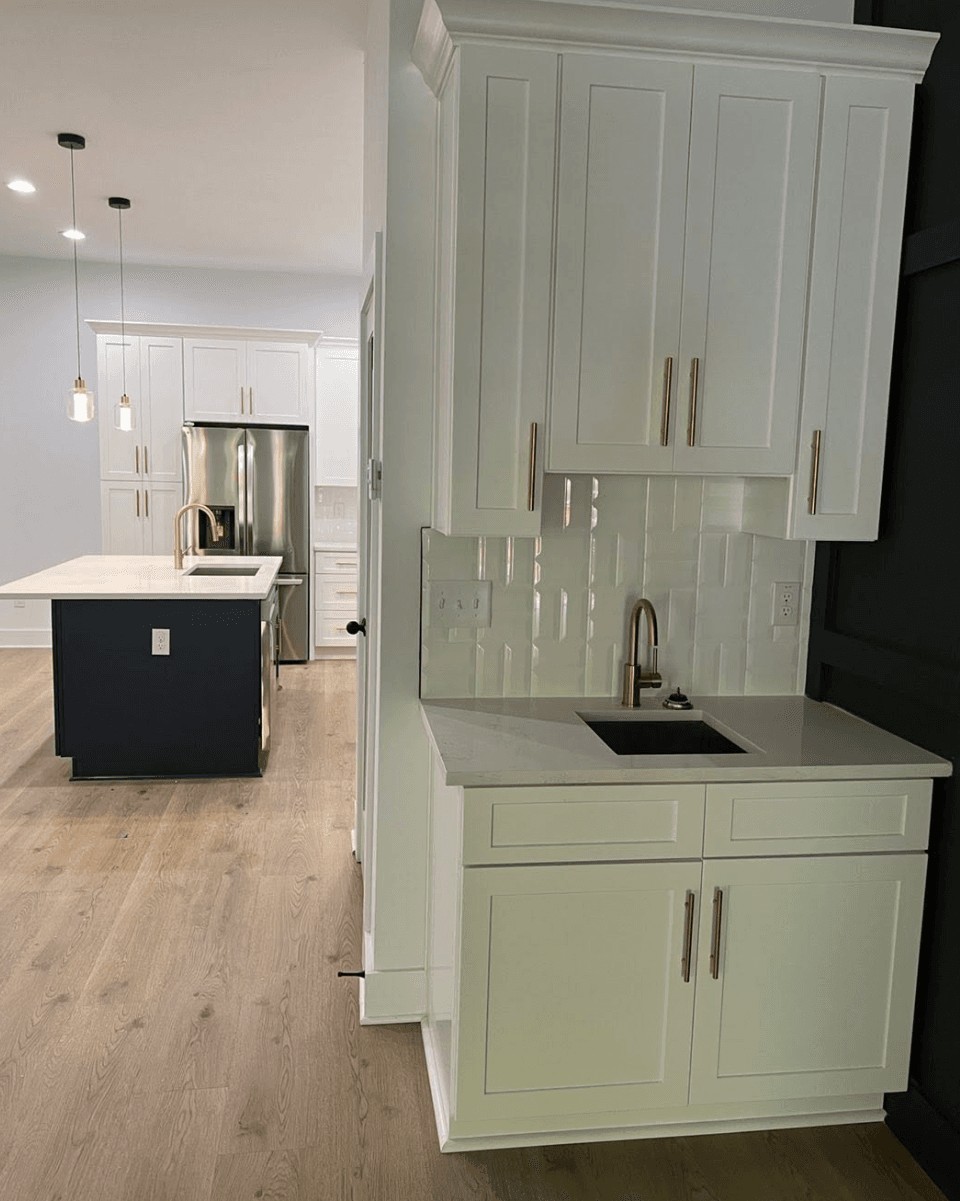 Duluth, GA · White shaker with subway tile backsplash and stainless appliances.