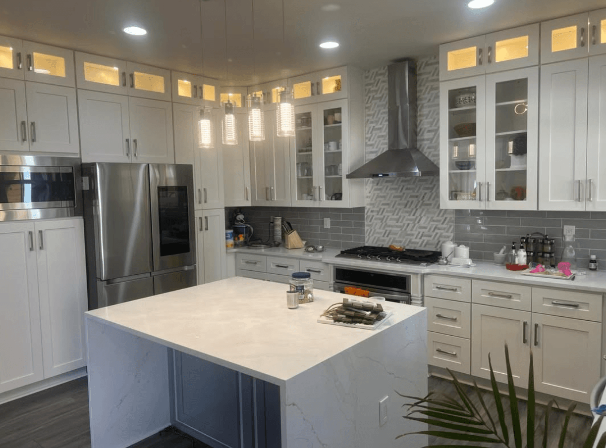 Tucker, GA · White uppers with glass-front displays and black pendant lights.