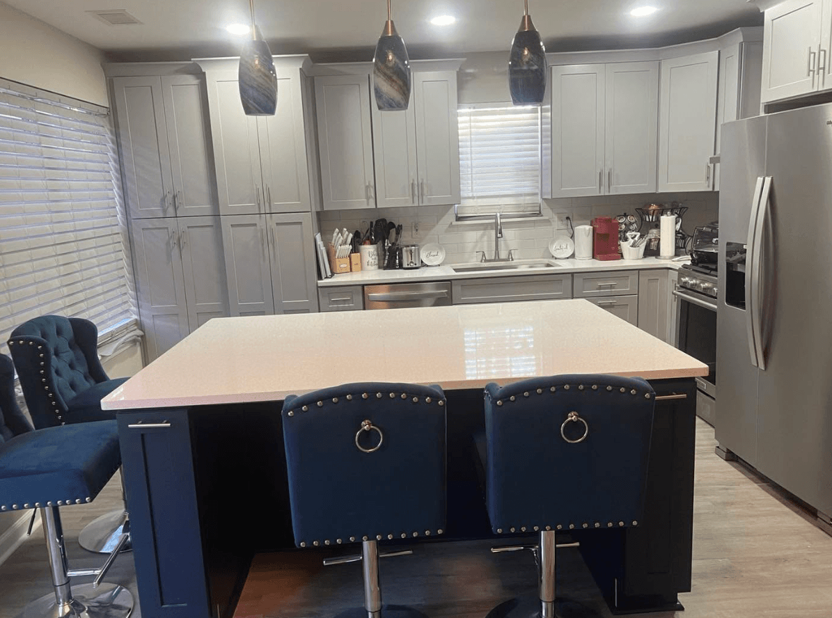 Stone Mountain, GA · Open kitchen with island, gas range, and walk-in pantry.