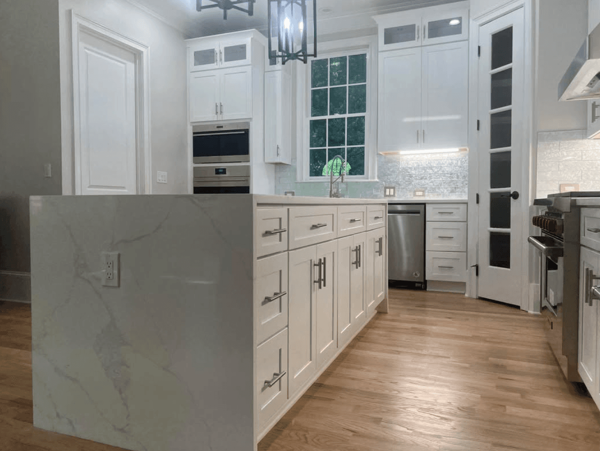 Canton, GA · Two-tone white shaker with stained walnut peninsula.