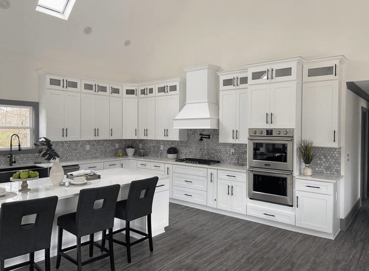 Gainesville, GA · White shaker with stained island and matte black hardware.