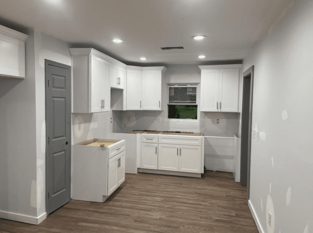 Doraville, GA · White U-shape with quartz tops and subway tile backsplash.