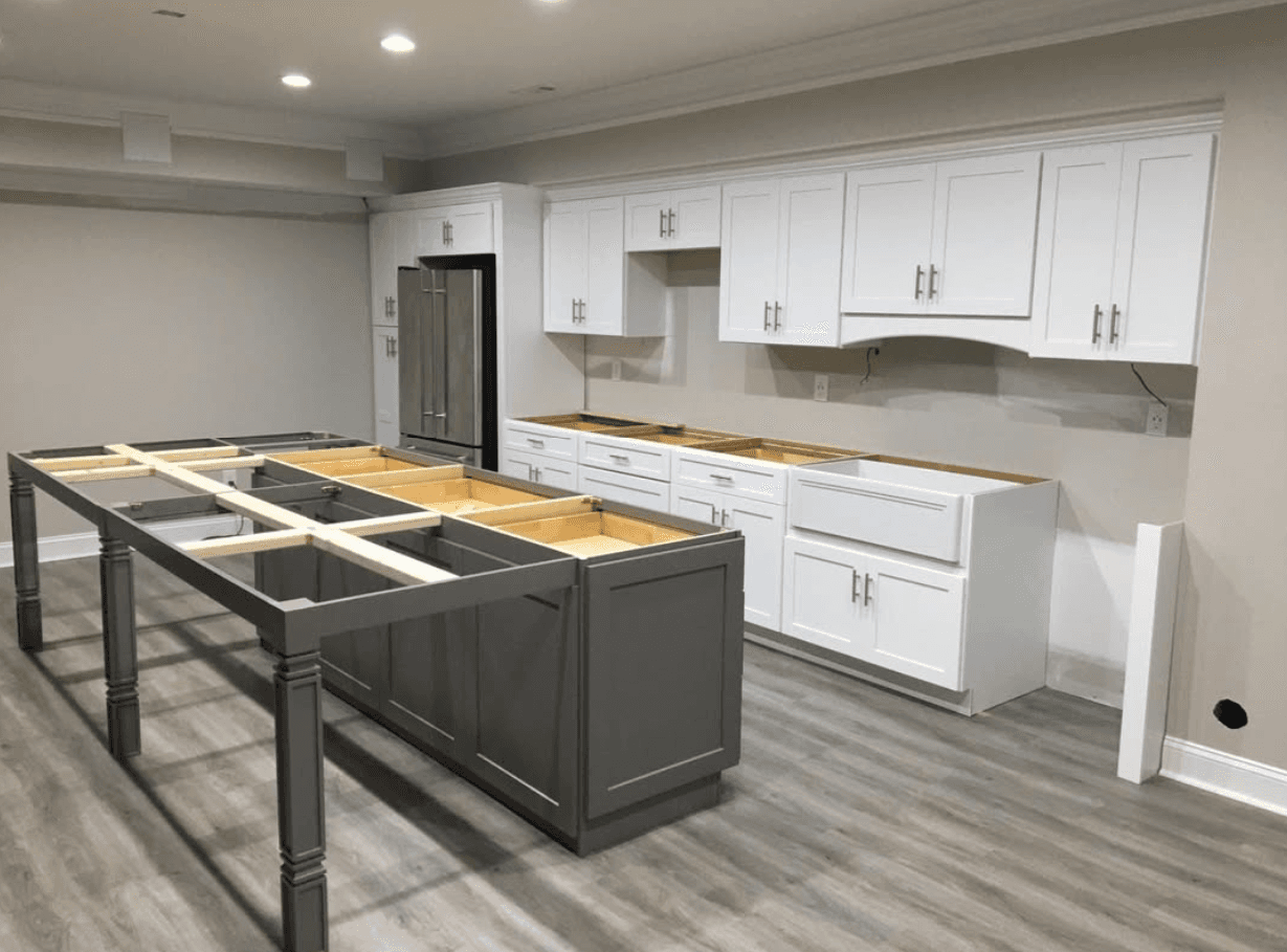 Vinings, GA · Two-tone shaker with painted island and brushed brass pulls.