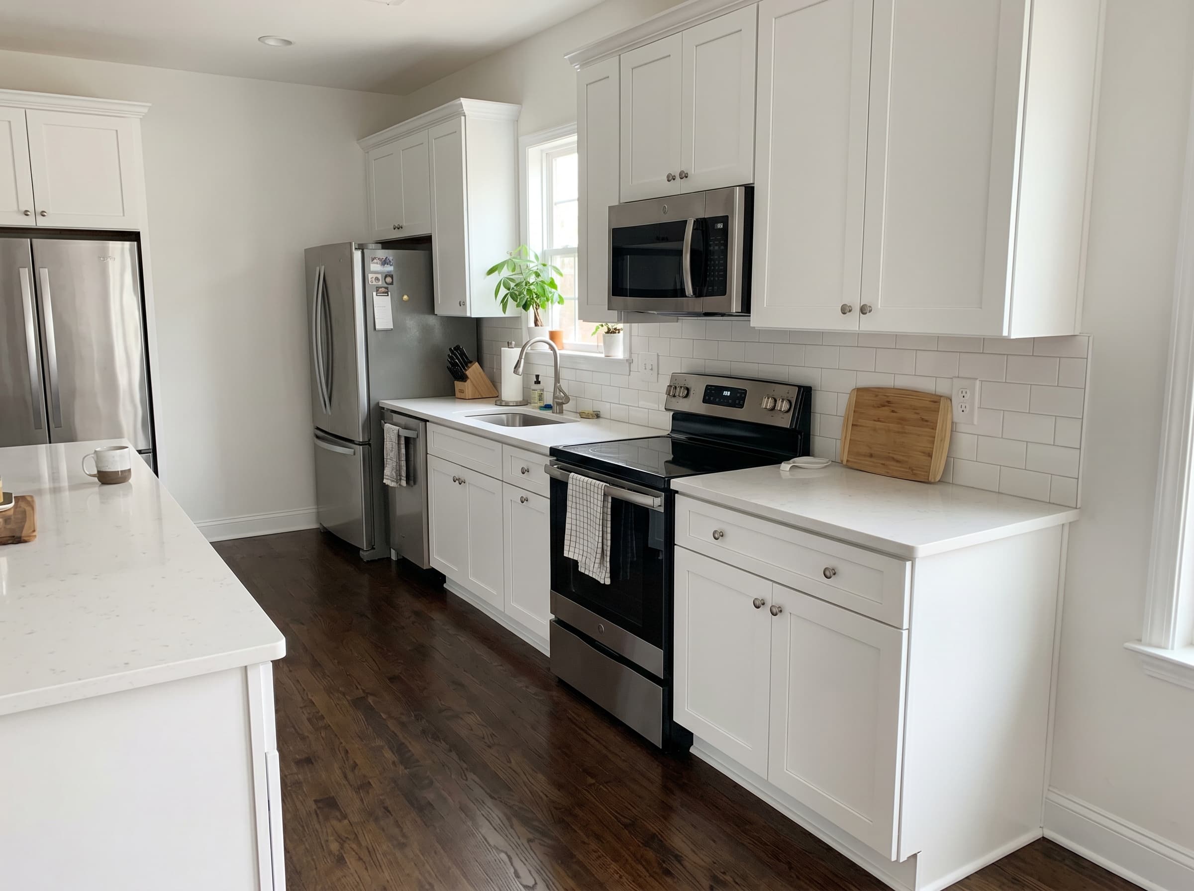 Alpharetta, GA · White shaker cabinets with brushed nickel knobs and quartz countertop.