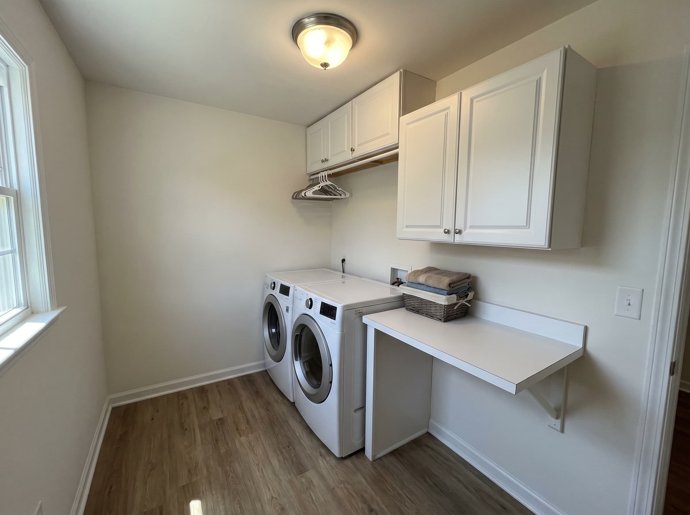 Lawrenceville, GA · Stacked front-load with upper shaker cabinets and folding counter.