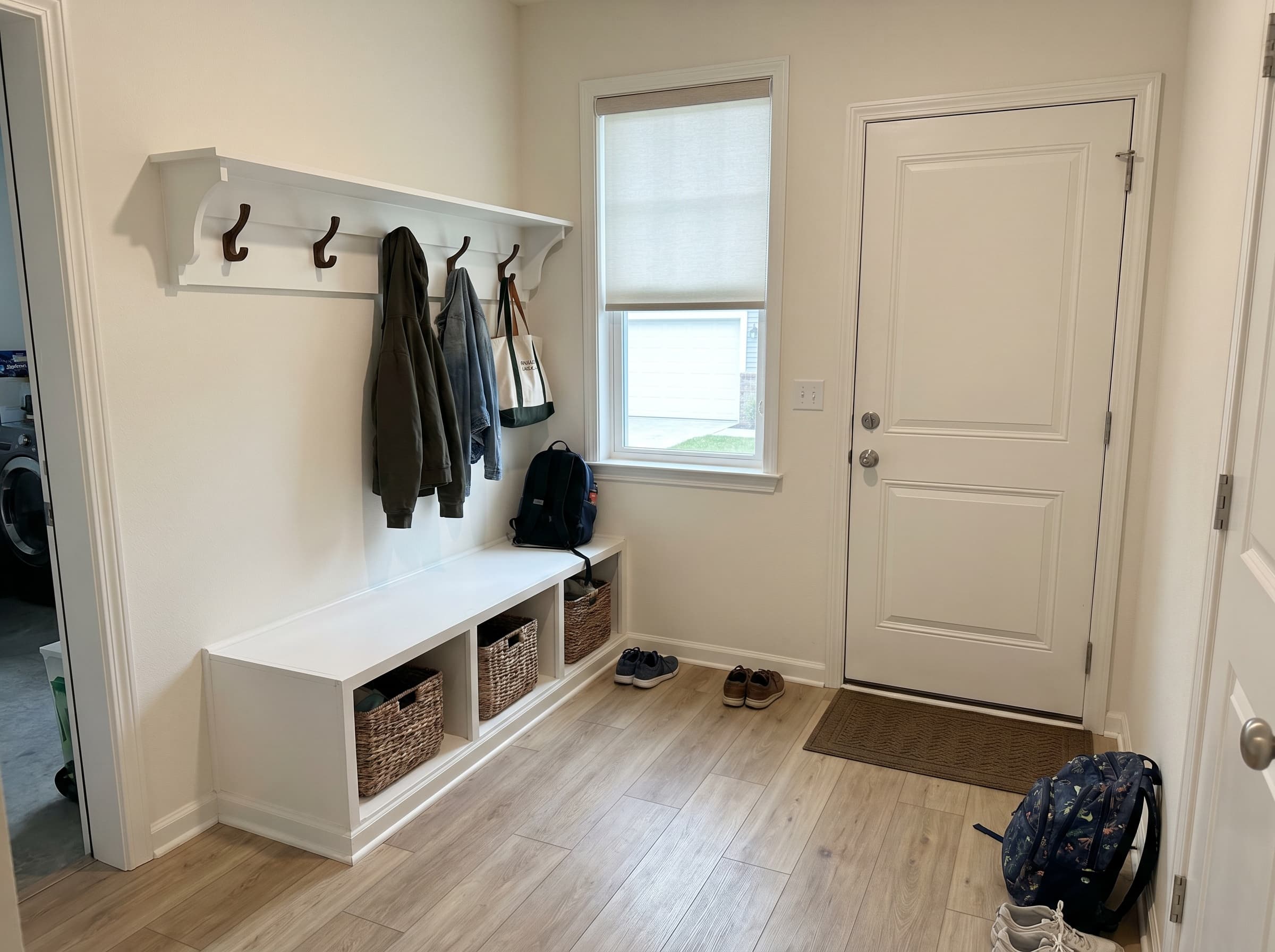 Kennesaw, GA · Garage-entry bench with cubbies and four coat hooks.