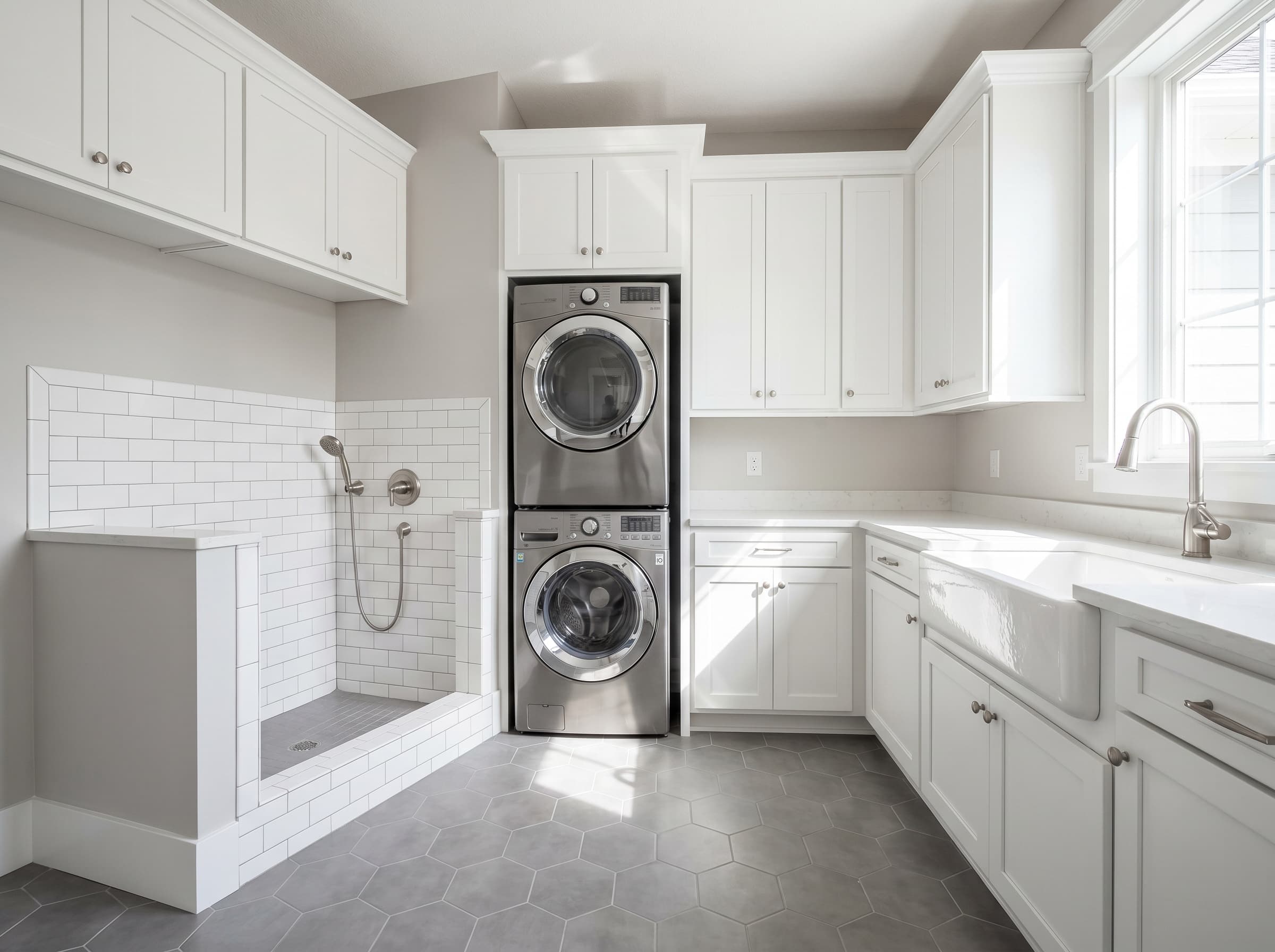 Brookhaven, GA · Laundry with built-in tiled dog-wash station.
