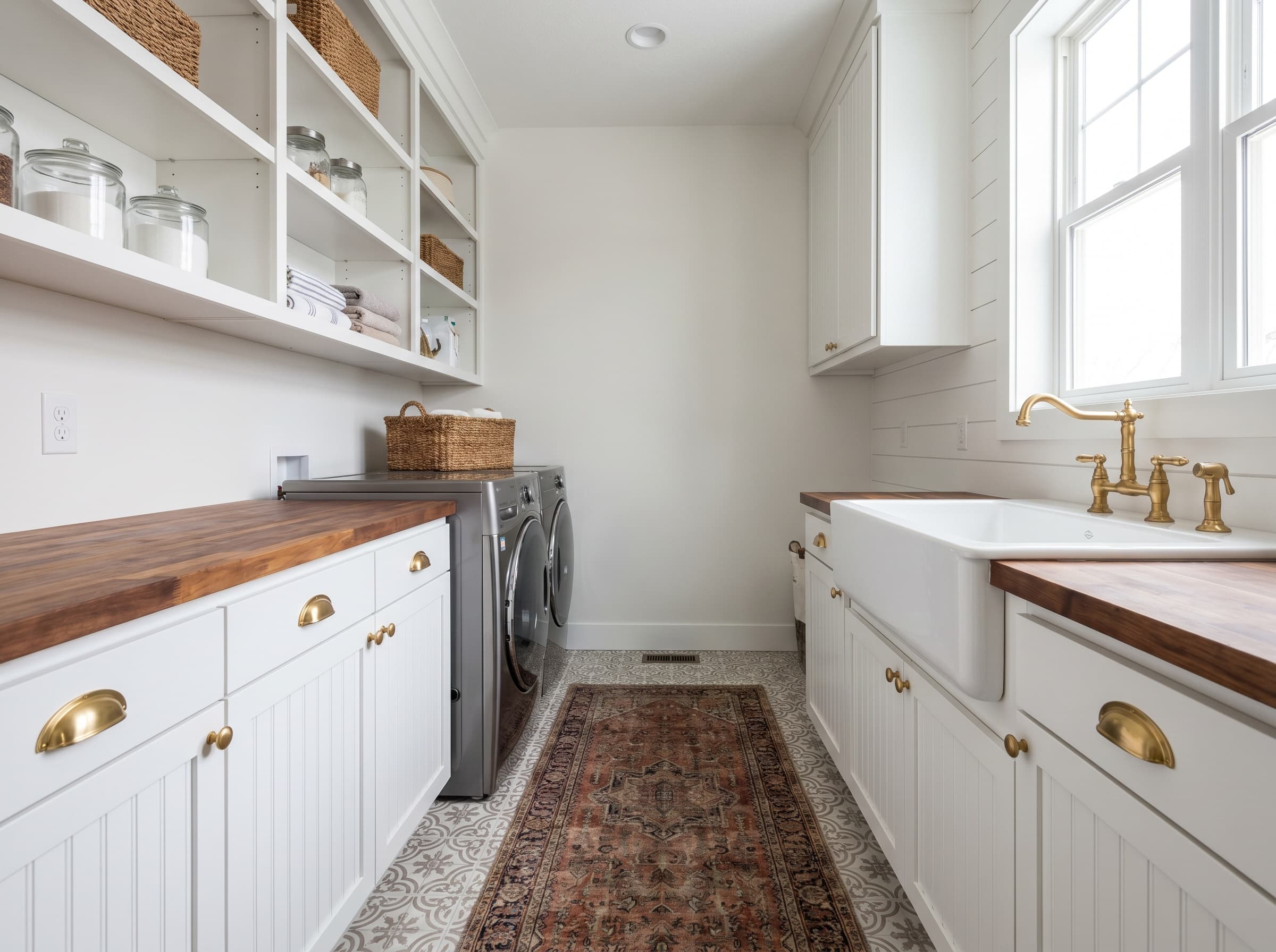 Smyrna, GA · Beadboard lowers with vintage runner and apron sink.