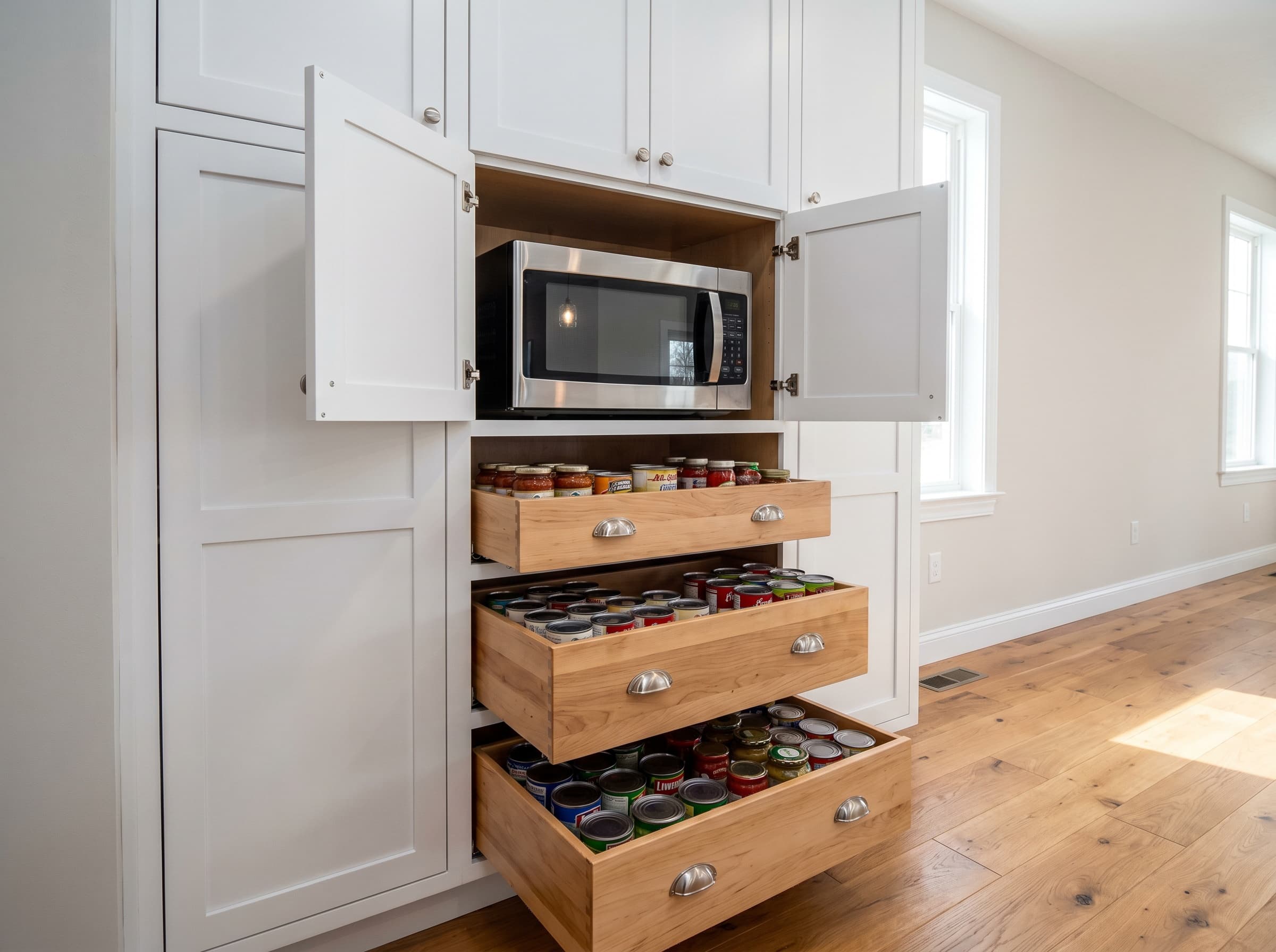 Norcross, GA · Built-in pantry with recessed microwave and roll-out drawers.