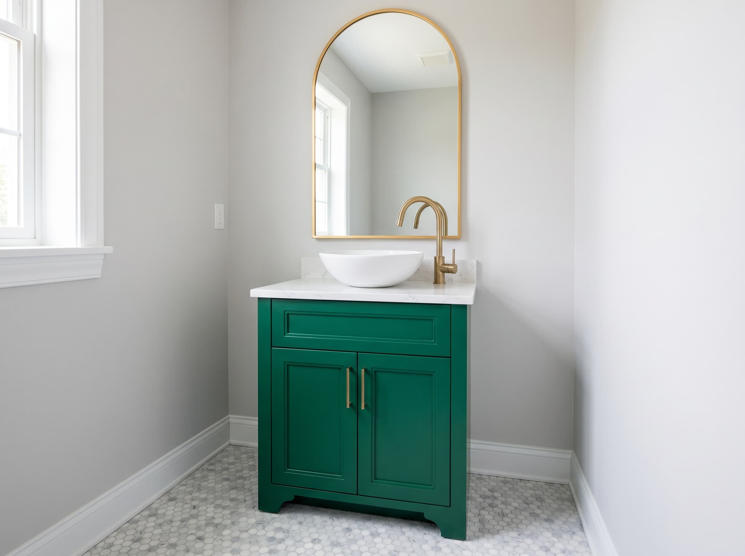 Woodstock, GA · 24" emerald green powder vanity with brass gooseneck faucet.